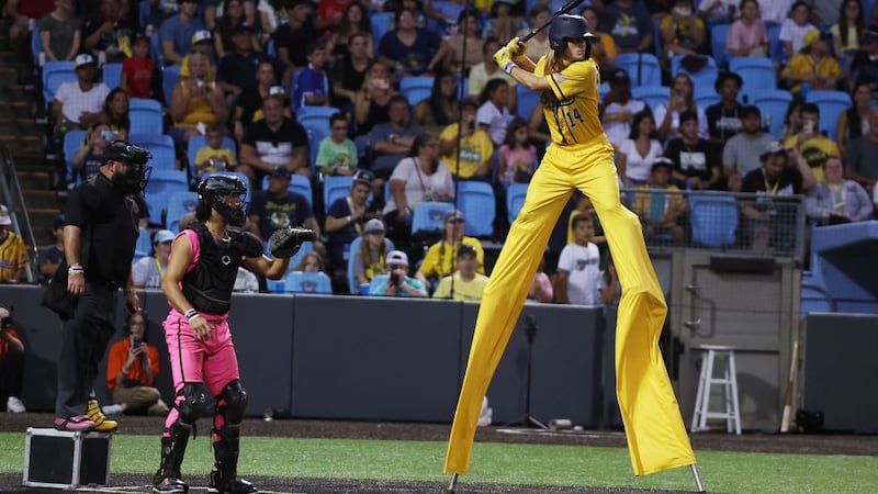 NEW YORK, NEW YORK - AUGUST 12:  Dakota "Stilts" Albritton #14 of the Savannah Bananas bats against the  Party Animals at Richmond County Bank Ball Park on August 12, 2023 in New York City.  The Savannah Bananas were part of the Coastal Plain League, a summer collegiate league, for seven seasons. In 2022, the Bananas announced that they were leaving the Coastal Plain League to play Banana Ball year-round. Banana Ball was born out of the idea of making baseball more fast-paced, entertaining, and fun.   (Photo by Al Bello/Getty Images)