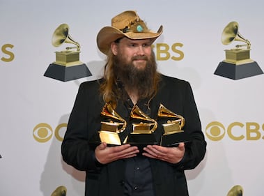 LAS VEGAS, NEVADA - APRIL 03: Chris Stapleton winner of Best Country Solo Performance, Best Country Song and Best Country Album poses in the winners photo room during the 64th Annual GRAMMY Awards at MGM Grand Garden Arena on April 03, 2022 in Las Vegas, Nevada. (Photo by David Becker/Getty Images for The Recording Academy)