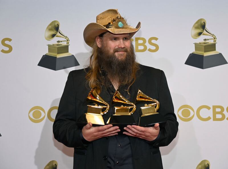 LAS VEGAS, NEVADA - APRIL 03: Chris Stapleton winner of Best Country Solo Performance, Best Country Song and Best Country Album poses in the winners photo room during the 64th Annual GRAMMY Awards at MGM Grand Garden Arena on April 03, 2022 in Las Vegas, Nevada. (Photo by David Becker/Getty Images for The Recording Academy)