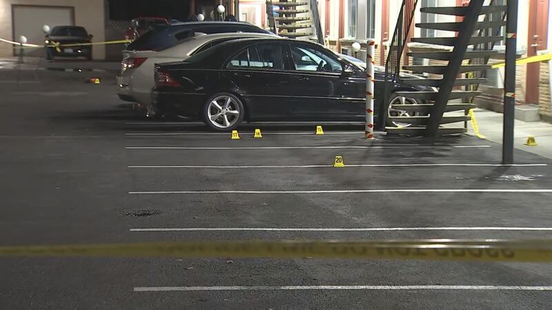 Dozens of evidence markers are strewn around the scene of an incident at a Kent motel.