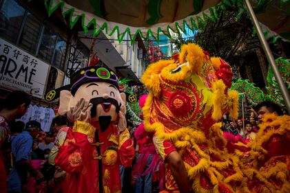MANILA, PHILIPPINES - FEBRUARY 10: Lion and dragon dancers perform during Lunar New Year celebrations at Binondo district, considered the world's oldest Chinatown, on February 10, 2024 in Manila, Philippines. Lunar New Year, also known as Chinese New Year, is celebrated around the world, and the year of the Wood Dragon in 2024 is associated with growth, progress, and abundance, as wood represents vitality and creativity, while the dragon symbolizes success, intelligence, and honor. (Photo by Ezra Acayan/Getty Images)