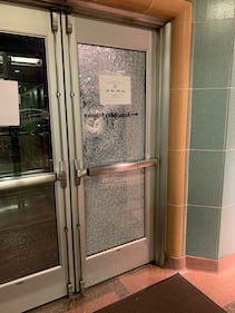 Multiple windows shattered at the William Kenzo Nakamura Courthouse at 6th Ave and Spring Street.