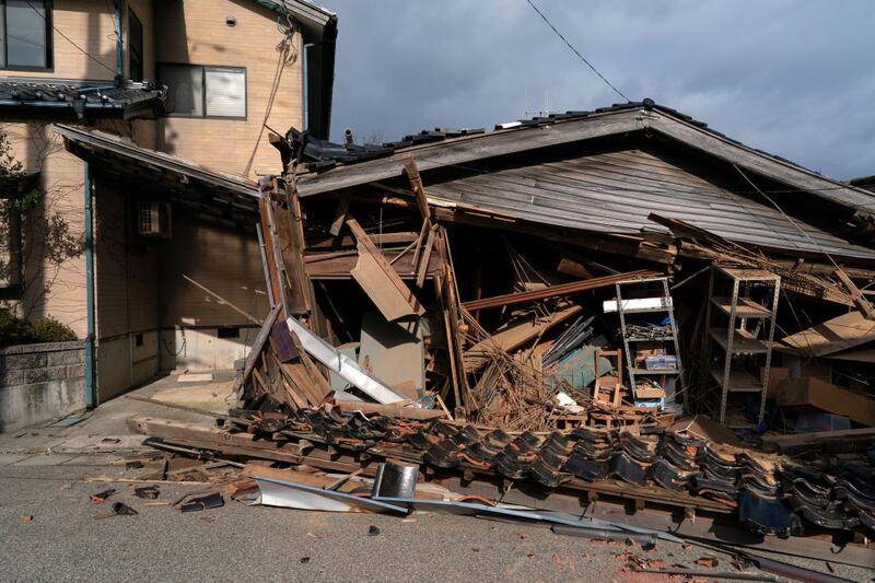 WAJIMA, JAPAN - JANUARY 05: Damaged houses are seen in the aftermath of an earthquake on January 05, 2024 in Wajima, Japan. On New Year's Day, a series of major earthquakes reportedly killed at least 92 people, injured dozens more and destroyed a large amount of homes. The earthquakes, the biggest measuring 7.1 magnitude, hit the areas around Ishikawa, Toyama and Niigata in central Japan. (Photo by Tomohiro Ohsumi/Getty Images)