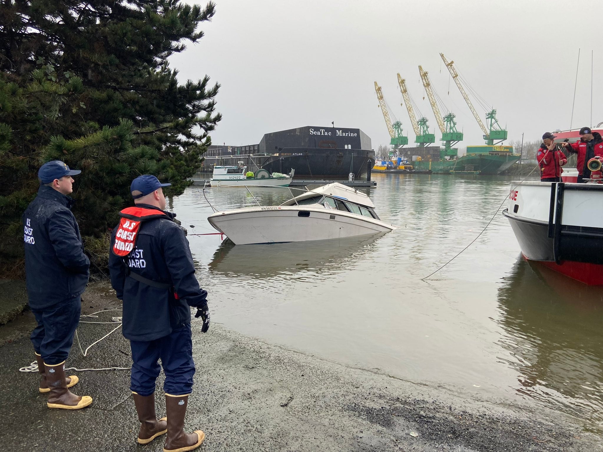 Partially sunken boat near Seattle boat ramp