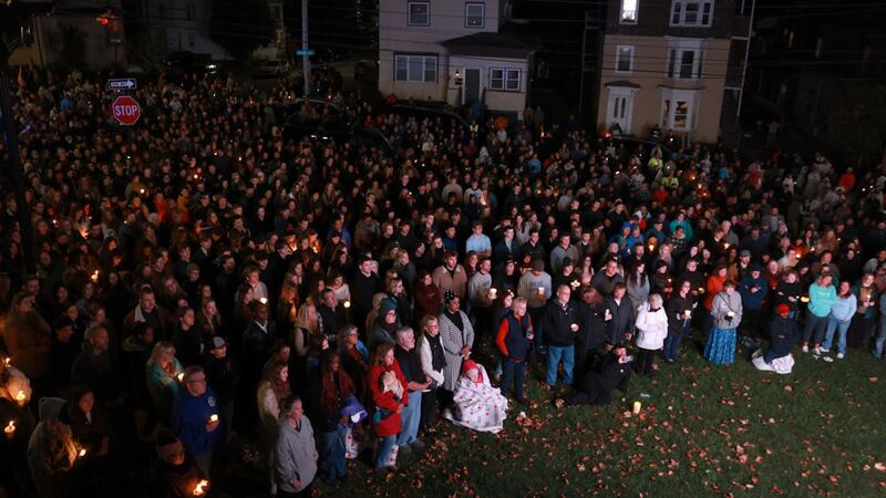 Crowd watched television screens outside the Basilica of Saints Peter and Paul during Sunday's vigil.