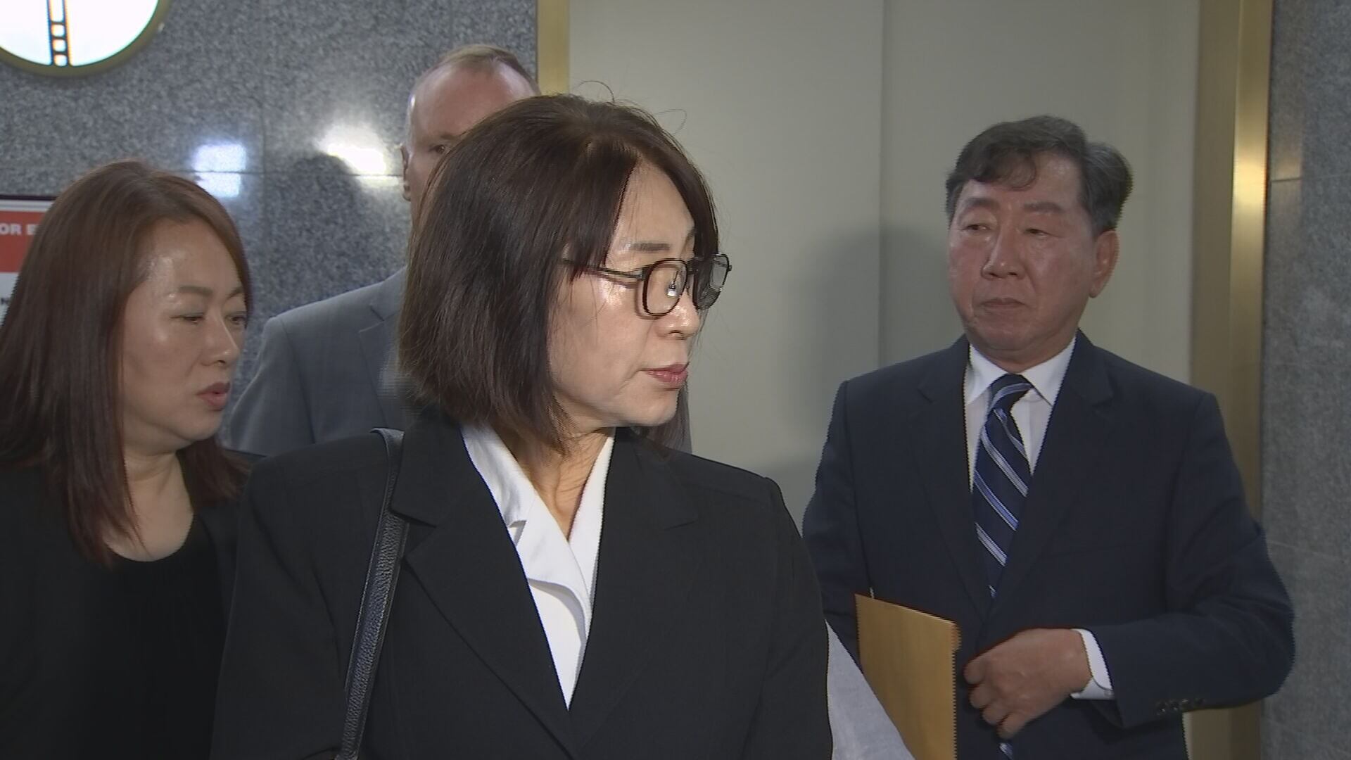 Business owner Yon Kim speaking to media on behalf of the local Korean-American community after Cordell Goosby pleaded guilty.