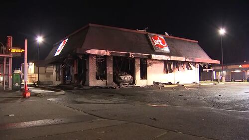 A Federal Way Jack in the Box is in shambles after a car slammed into the side of the restaurant and burst into flames.