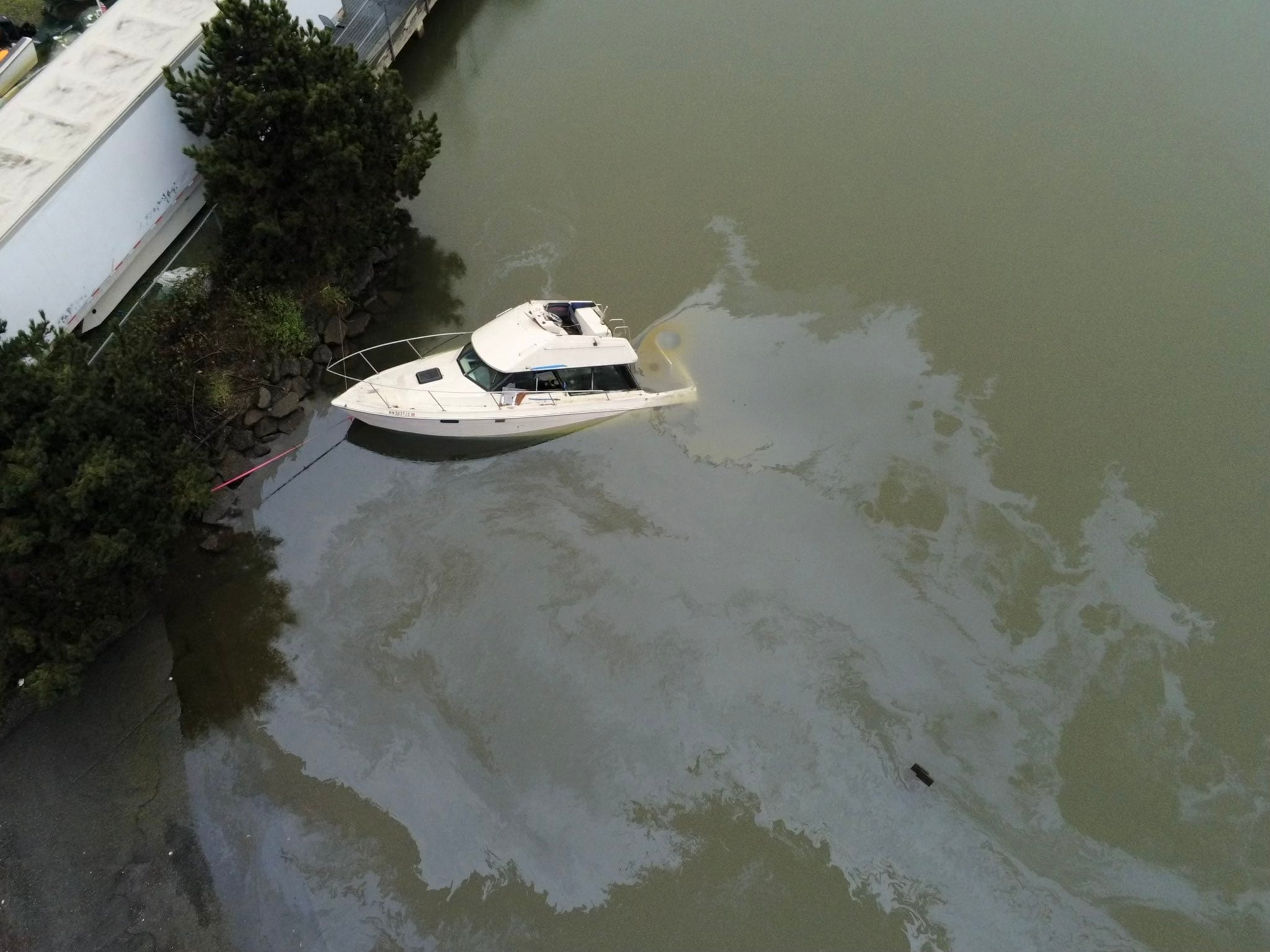 Partially sunken boat near Seattle boat ramp