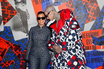 BROOKLYN, NEW YORK - SEPTEMBER 11: Kourtney Kardashian and Travis Barker attend Tommy Factory New York Fall 2022 at Skyline Drive-In on September 11, 2022 in Brooklyn, New York. (Photo by Astrid Stawiarz/Getty Images for Tommy Hilfiger)