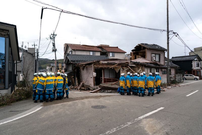 WAJIMA, JAPAN - JANUARY 05: Police officers search for survivors in the aftermath of an earthquake on January 05, 2024 in Wajima, Japan. On New Year's Day, a series of major earthquakes reportedly killed at least 92 people, injured dozens more and destroyed a large amount of homes. The earthquakes, the biggest measuring 7.1 magnitude, hit the areas around Ishikawa, Toyama and Niigata in central Japan. (Photo by Tomohiro Ohsumi/Getty Images)