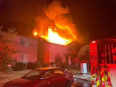 The intense radiant heat from the fire caused damage to the homes on either side.