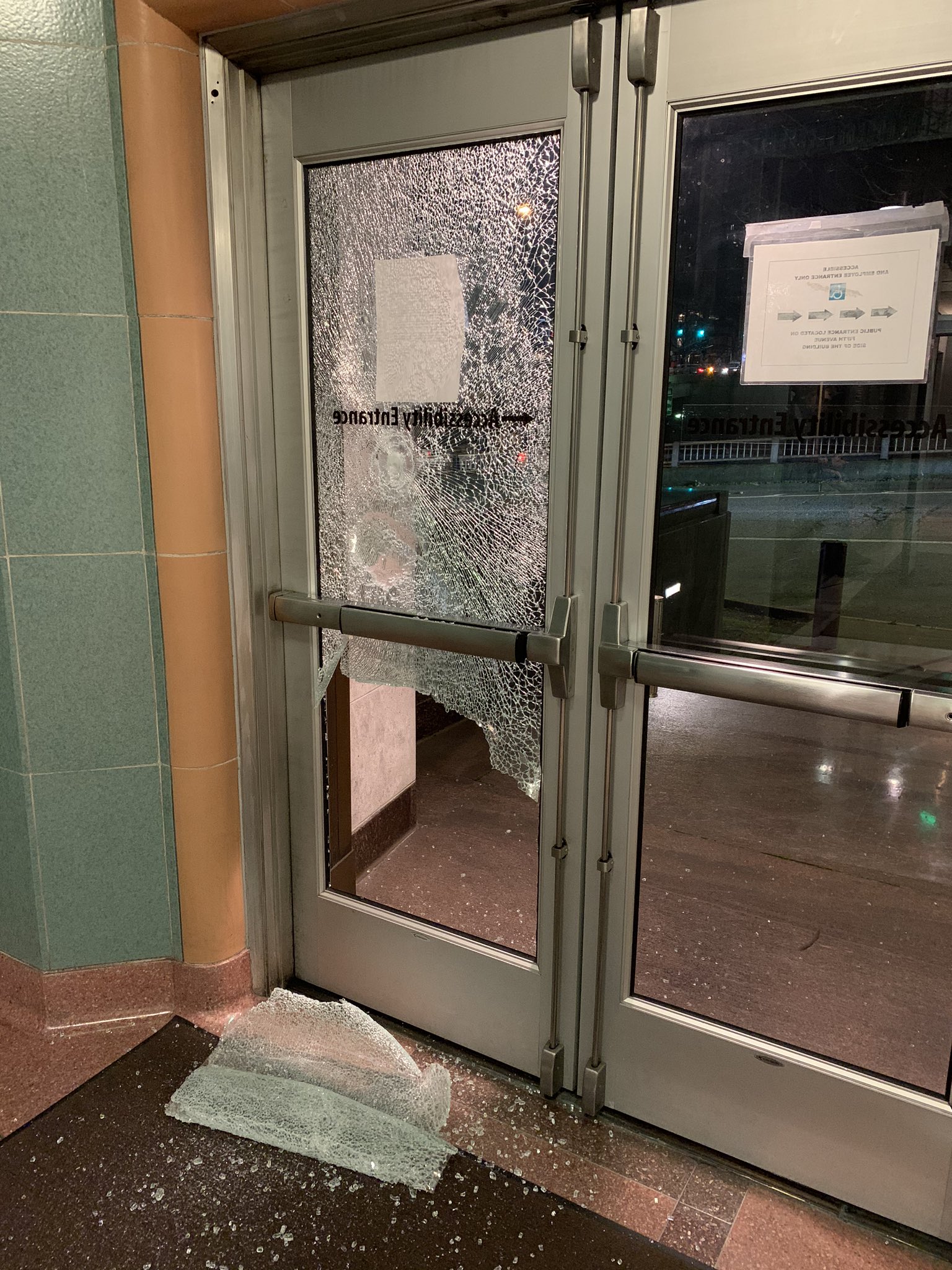 Multiple windows shattered at the William Kenzo Nakamura Courthouse at 6th Ave and Spring Street.