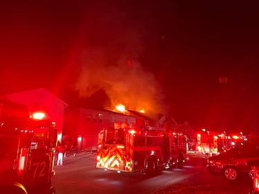 The intense radiant heat from the fire caused damage to the homes on either side.