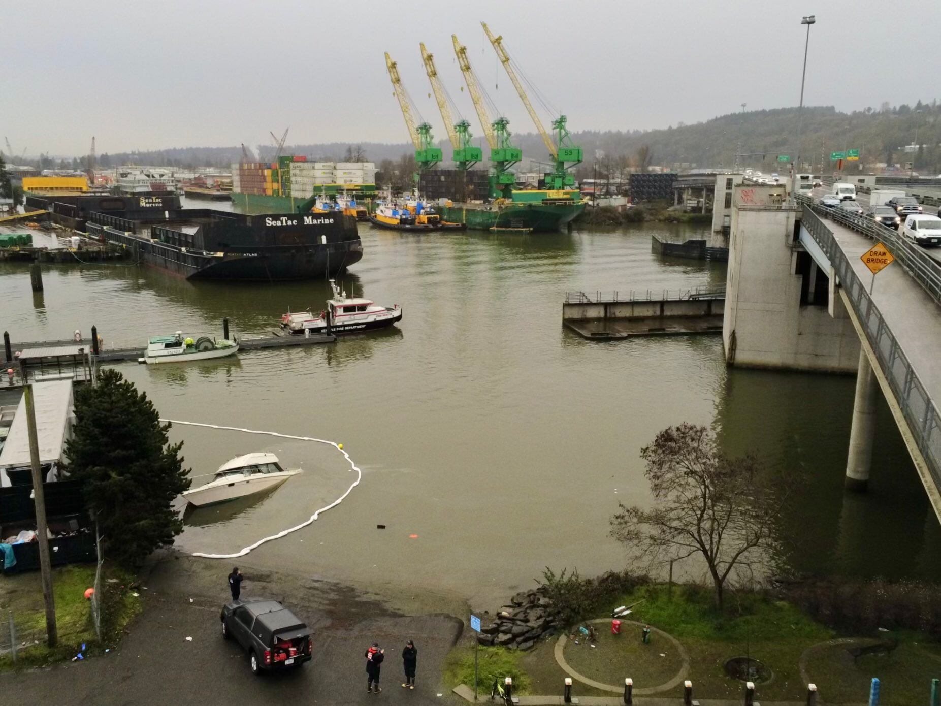 Partially sunken boat near Seattle boat ramp