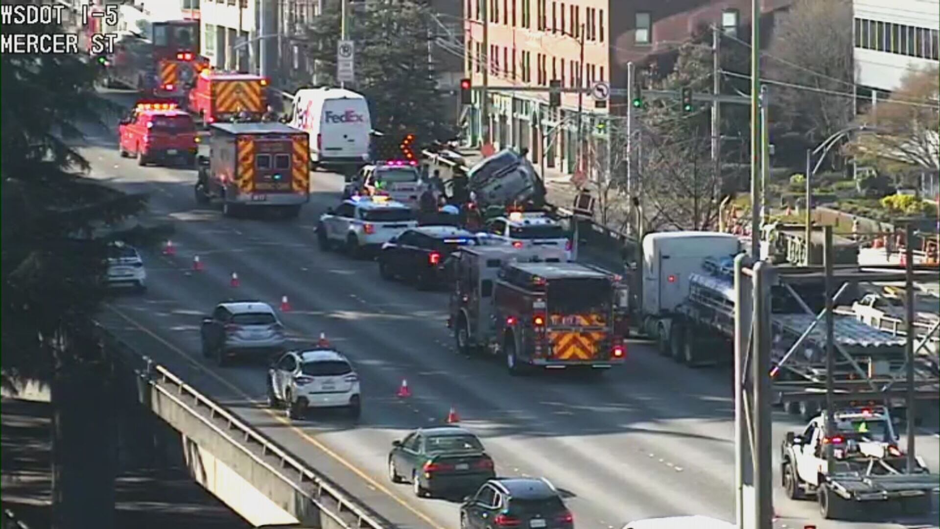 The truck is on southbound I-5 near Mercer Street, which is an elevated section of the freeway.