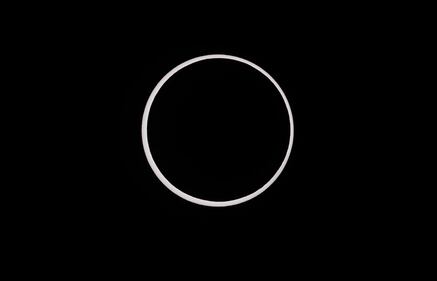 CAPITOL REEF NATIONAL PARK, UTAH - OCTOBER 14:  The moon crosses the sun completing its maximum eclipse during the Annular Solar Eclipse  on October 14, 2023 in Capitol Reef National Park, Utah. Starting at the Oregon coast and concluding on the east coast of South America an annular solar eclipse, where the moon is at its farthest from the Earth, will project a halo of sunlight around the moon's border.  (Photo by George Frey/Getty Images)