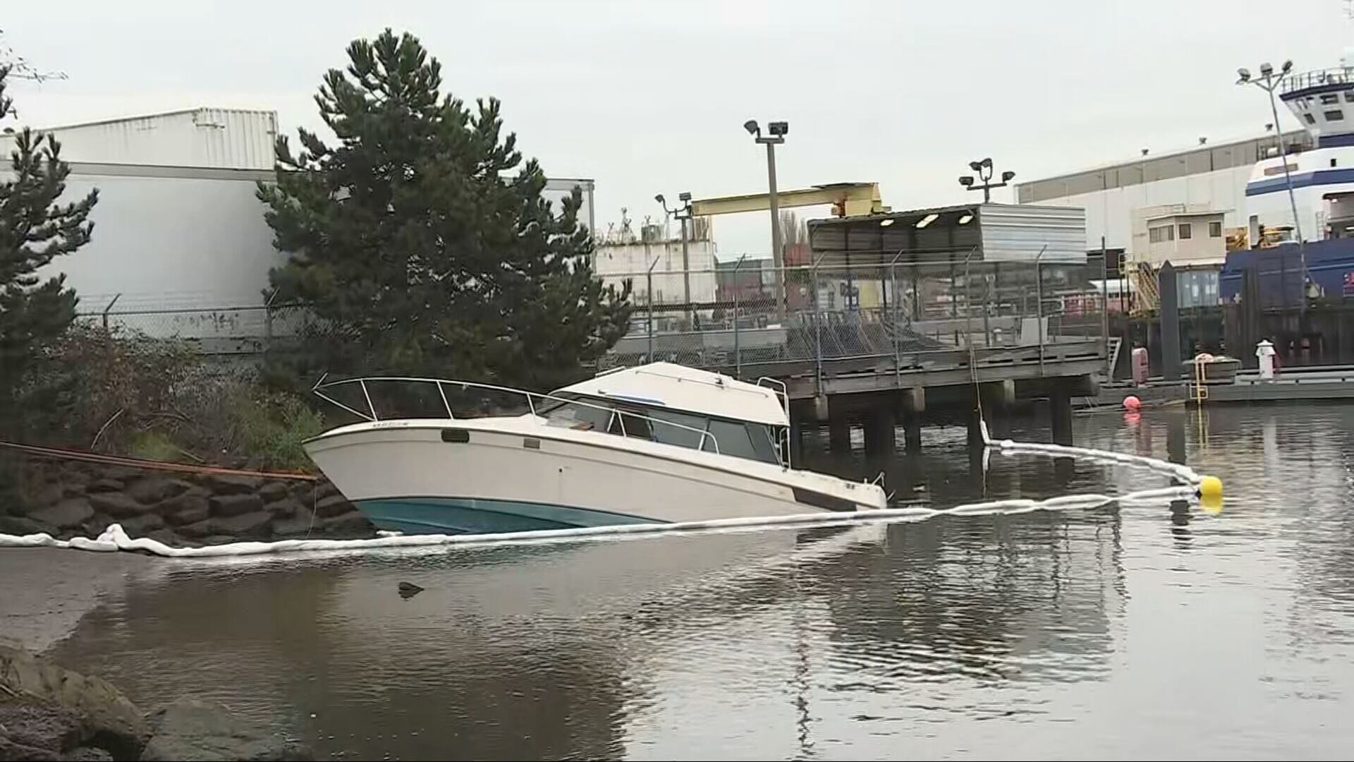 Partially sunken boat near Seattle boat ramp