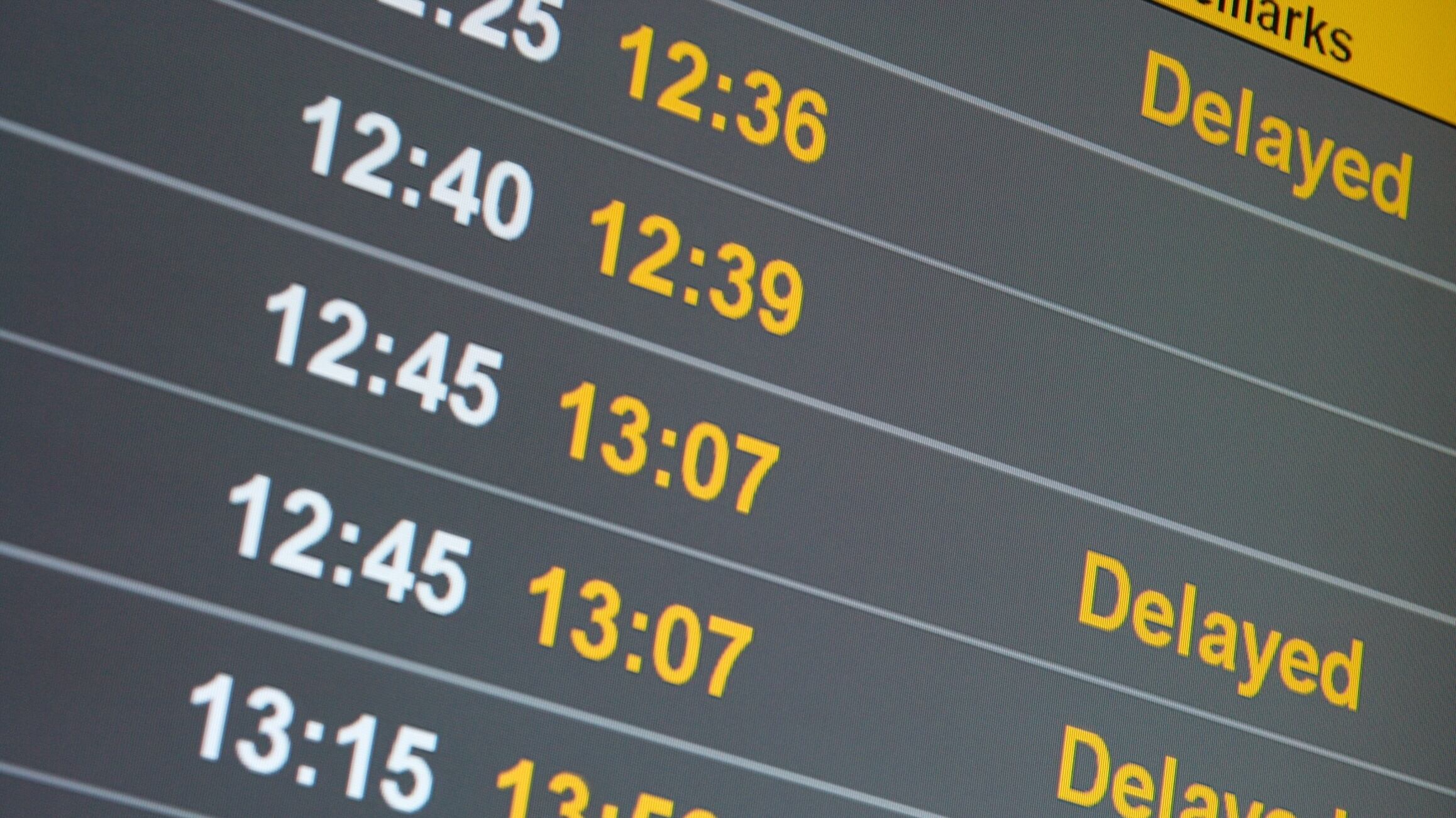 Many delayed flights on the departure table of an airport