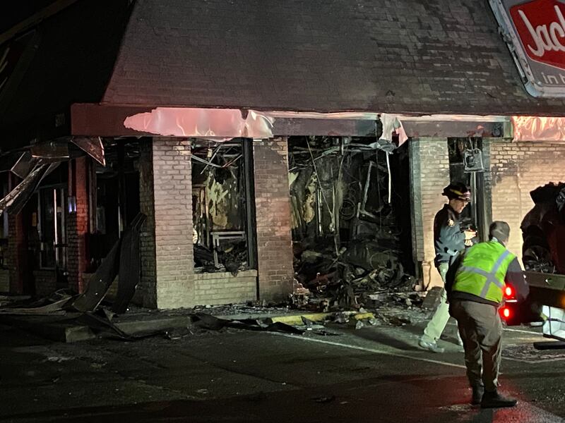 A Federal Way Jack in the Box is in shambles after a car slammed into the side of the restaurant and burst into flames.