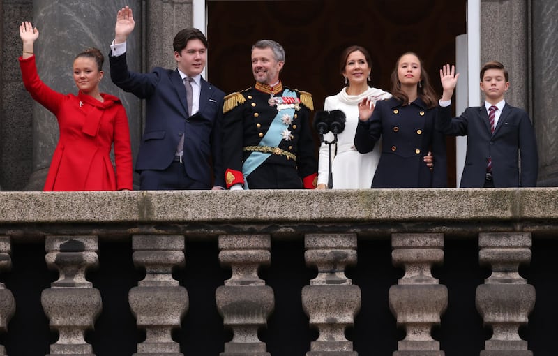 COPENHAGEN, DENMARK - JANUARY 14: (L-R) Princess Isabella of Denmark, Prince Christian of Denmark, King Frederik X of Denmark, Queen Mary of Denmark, Princess Josephine of Denmark and Prince Vincent of Denmark wave to the crowd after a declaration of the King's accession to the throne, from the balcony of Christiansborg Palace on January 14, 2024 in Copenhagen, Denmark. King Frederik X is succeeding Queen Margrethe II, who will be stepping down after reigning for 51 years. (Photo by Sean Gallup/Getty Images)