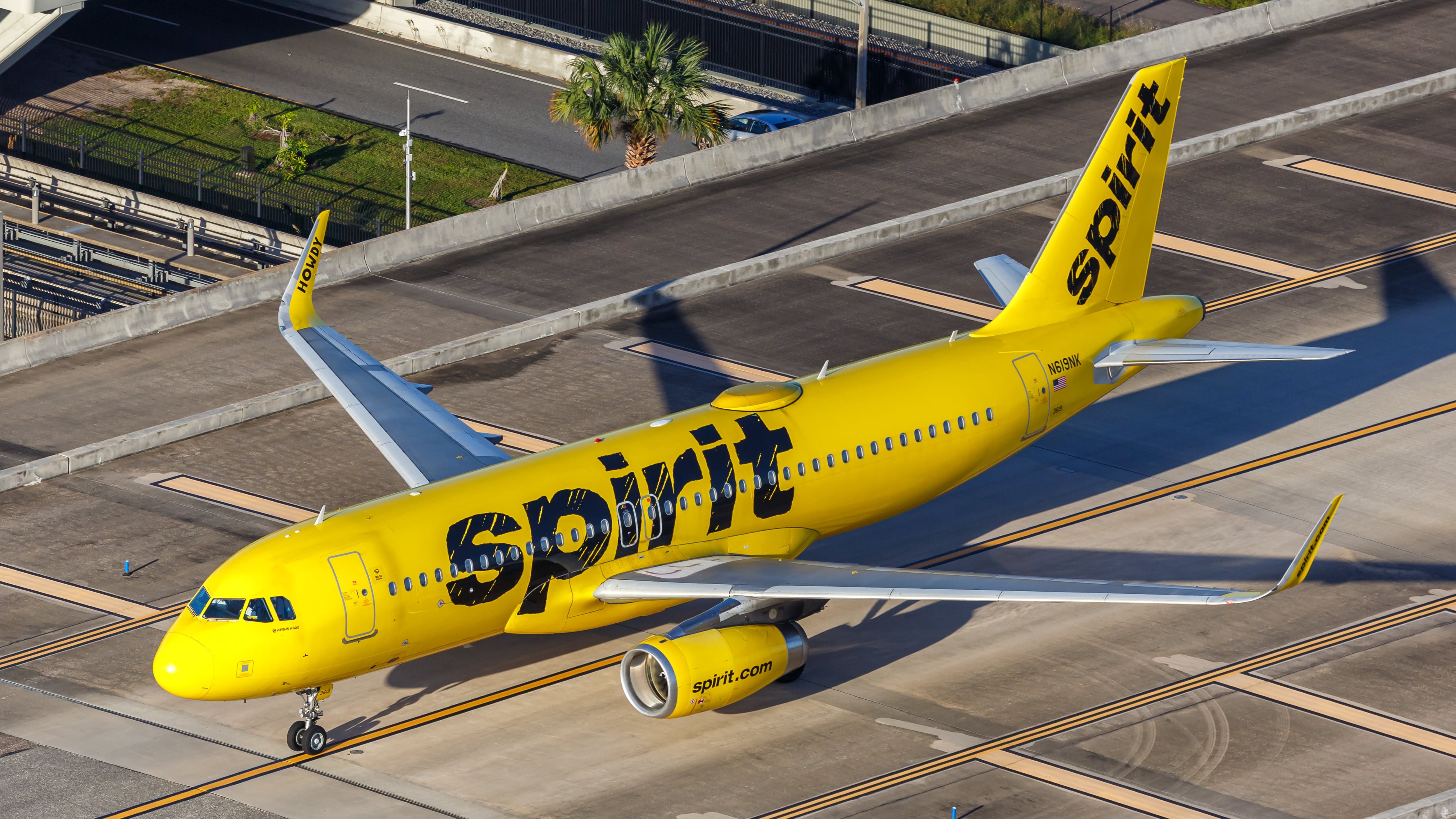 Aerial view photo of Spirit Airbus A320 airplane at Orlando Airport, United States.