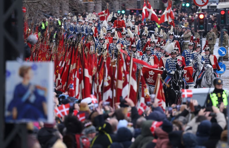 COPENHAGEN, DENMARK - JANUARY 14: A mounted procession leads a carriage carrying Danish Queen Margrethe II to Christiansborg Palace prior to the monarchial transition on January 14, 2024 in Copenhagen, Denmark. King Frederik X is succeeding Queen Margrethe II, who will be stepping down after reigning for 51 years. (Photo by Sean Gallup/Getty Images)