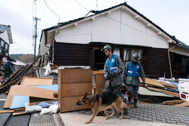 WAJIMA, JAPAN - JANUARY 05: Members of the Self Defense Forces search for survivors in the aftermath of an earthquake on January 05, 2024 in Wajima, Japan. On New Year's Day, a series of major earthquakes reportedly killed at least 92 people, injured dozens more and destroyed a large amount of homes. The earthquakes, the biggest measuring 7.1 magnitude, hit the areas around Ishikawa, Toyama and Niigata in central Japan. (Photo by Tomohiro Ohsumi/Getty Images)