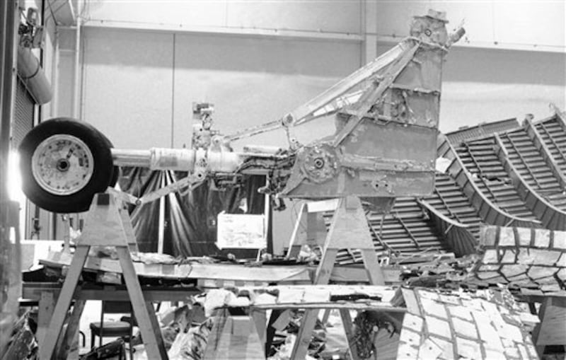 This is the portion of the right hand solid rocket booster at Kennedy Space Center, Florida on June 12, 1986, which is being blamed for the explosion on January 28, which destroyed the Space Shuttle Challenger and killed the 7 crew members. Visible in the lower left is the section which burned through and allowed hot gases to escape and burn into the External Fuel Tank. (AP Photo/James Neihouse)