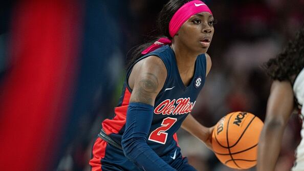 Players from both teams helped Davis when she lost her wig during a play early in the game.