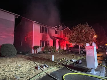 The intense radiant heat from the fire caused damage to the homes on either side.