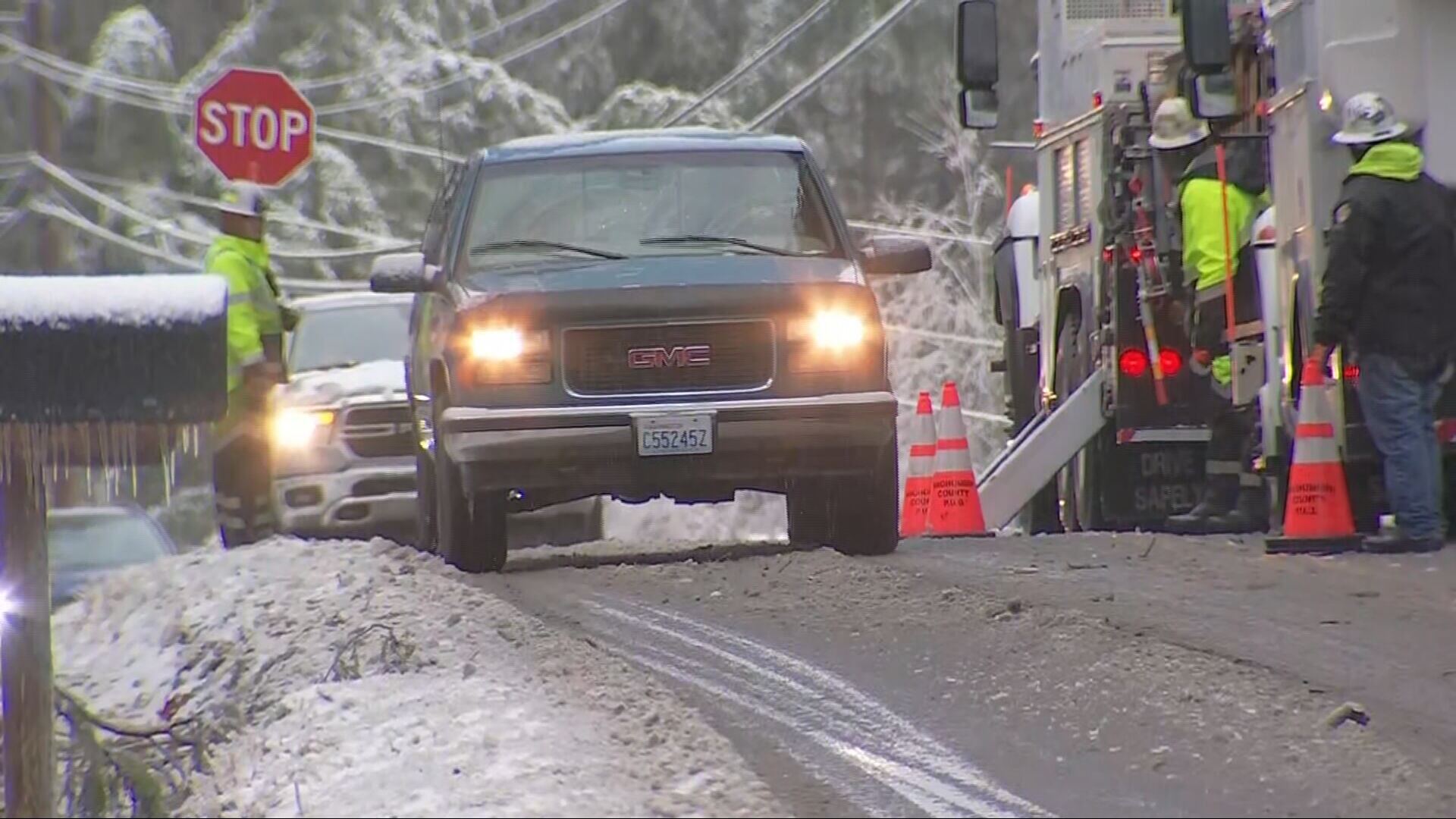 Crews at the scene of downed power lines in Monroe