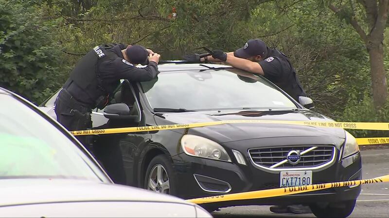 A woman shot at two suspects who tried to rob her while she sat in her car outside the Auburn Walmart.