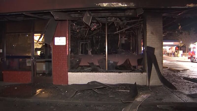 A Federal Way Jack in the Box is in shambles after a car slammed into the side of the restaurant and burst into flames.