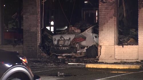 A Federal Way Jack in the Box is in shambles after a car slammed into the side of the restaurant and burst into flames.