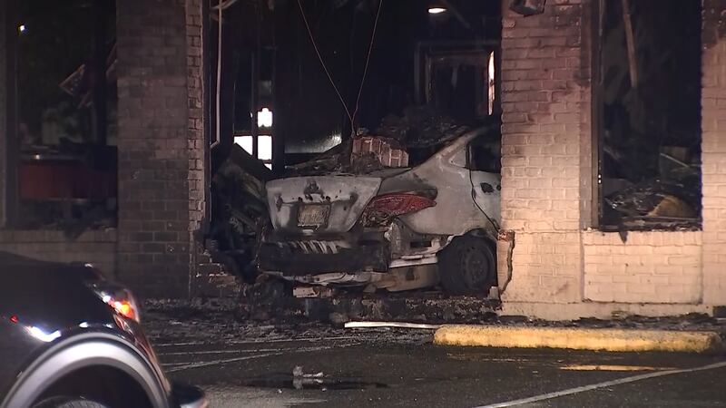 A Federal Way Jack in the Box is in shambles after a car slammed into the side of the restaurant and burst into flames.