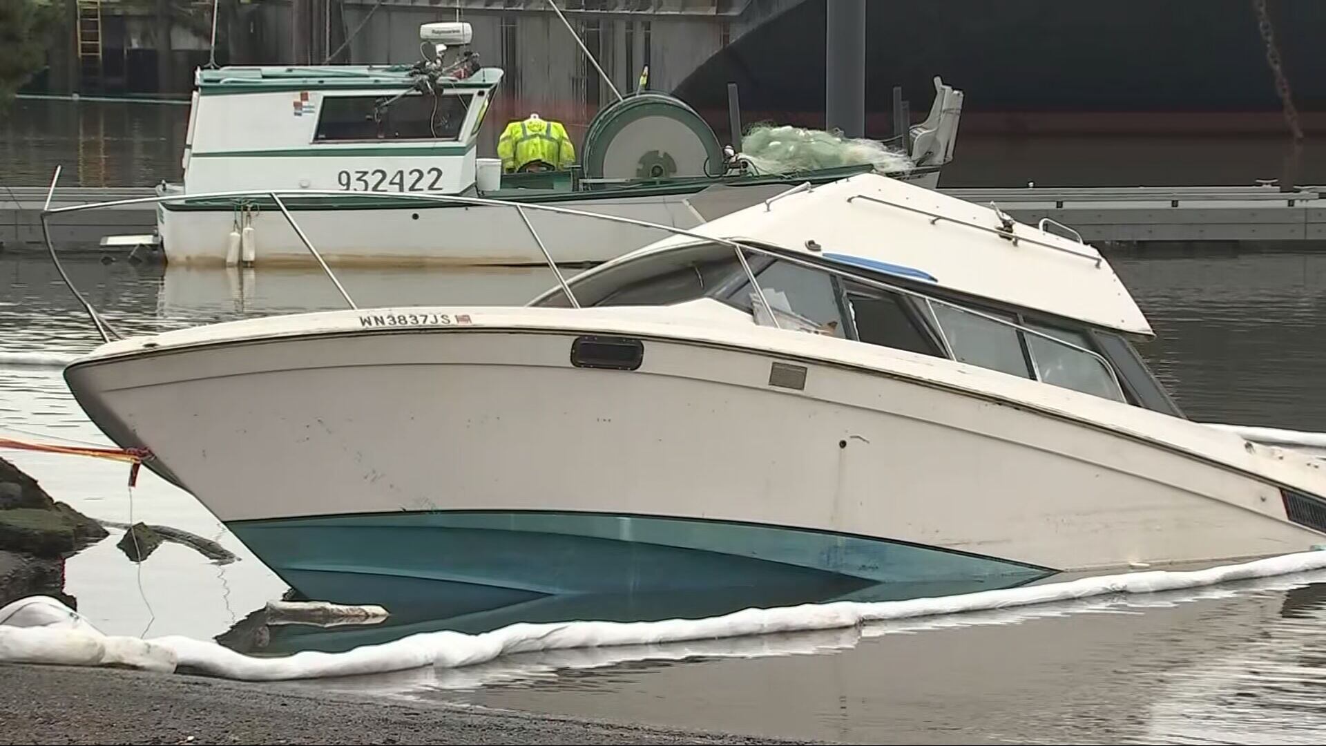 Partially sunken boat near Seattle boat ramp