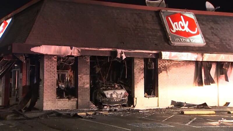 A Federal Way Jack in the Box is in shambles after a car slammed into the side of the restaurant and burst into flames.