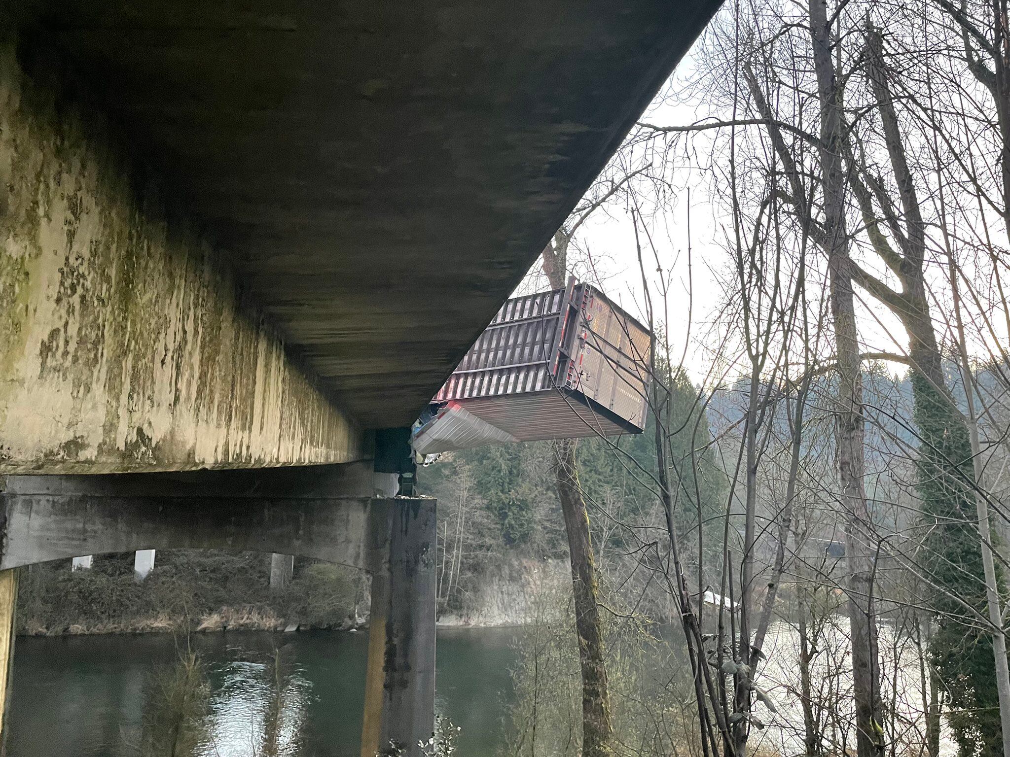 A semitruck hit the Green River Bridge, causing it to roll over and crash, blocking eastbound SR 18.