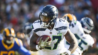 <p>LOS ANGELES, CA - NOVEMBER 11: Running back Mike Davis #27 of the Seattle Seahawks moves the ball in the game against the Los Angeles Rams on November 11, 2018 in Los Angeles, California. (Photo by Harry How/Getty Images)</p>