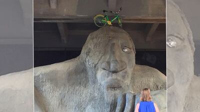 <p>Bike parked atop Fremont troll. Photo: Reddit user Chaoschao99.</p>
