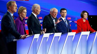 Democratic presidential candidate Sen. Bernie Sanders, I-Vt., center, speaks as fellow candidates businessman Tom Steyer, from left, Sen. Elizabeth Warren, D-Mass., former Vice President Joe Biden, former South Bend Mayor Pete Buttigieg and Sen. Amy Klobuchar, D-Minn. listen, Tuesday, Jan. 14, 2020, during a Democratic presidential primary debate hosted by CNN and the Des Moines Register in Des Moines, Iowa.
