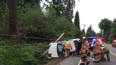 <p>A vehicle crashed into a pole in the 34600 block of Military Road South in Auburn on Wednesday night (Credit: South King Fire)</p>