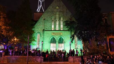 Protesters wait outside the First Unitarian church, Thursday, Sept. 24, 2020, in Louisville, Ky.