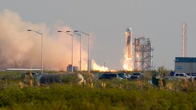 Blue Origin's New Shepard rocket launches carrying passengers Jeff Bezos, founder of Amazon and space tourism company Blue Origin, brother Mark Bezos, Oliver Daemen and Wally Funk, from its spaceport near Van Horn, Texas, Tuesday, July 20, 2021. (AP Photo/Tony Gutierrez)