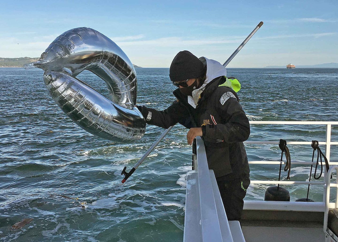 Eagle Wing staff retrieving balloons