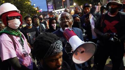 The Rev. Dr. Charles Elliott Jr., speaks with demonstrators, Thursday, Sept. 24, 2020, in Louisville, Ky.