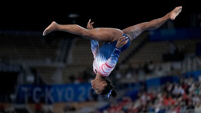 Simone Biles, of the United States, performs on the balance beam during the artistic gymnastics women's apparatus final at the 2020 Summer Olympics, Tuesday, Aug. 3, 2021, in Tokyo, Japan.