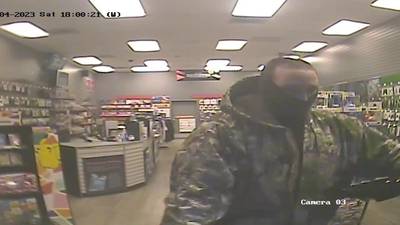 PHOTOS: Gig Harbor police seek armed robber of a Game Stop