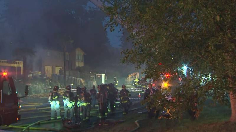 A 3-alarm fire caused a home under construction to collapse and damaged two others in Seattle's Mount Baker neighborhood.