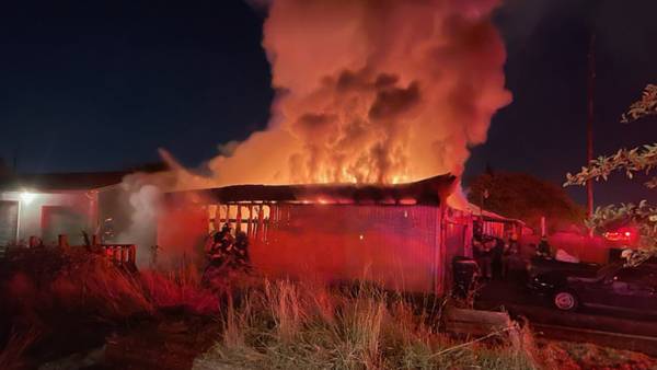 Firefighters arrive at North Tacoma garage to find it enveloped in flames